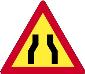 Road narrows from both sides