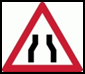 Road narrows from both sides